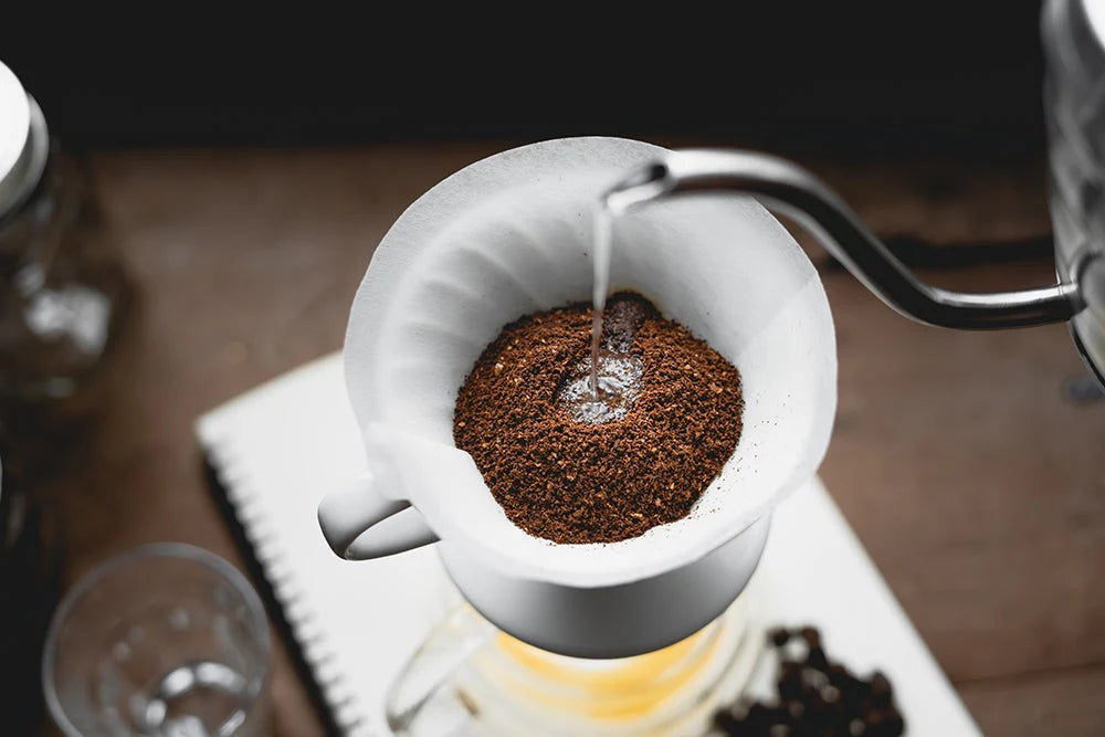 A v60 being made using a white hario 02 v60 coffee filter