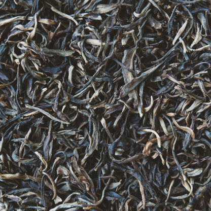 Close up view of Raw Mountain Puerh loose leaf tea leaves