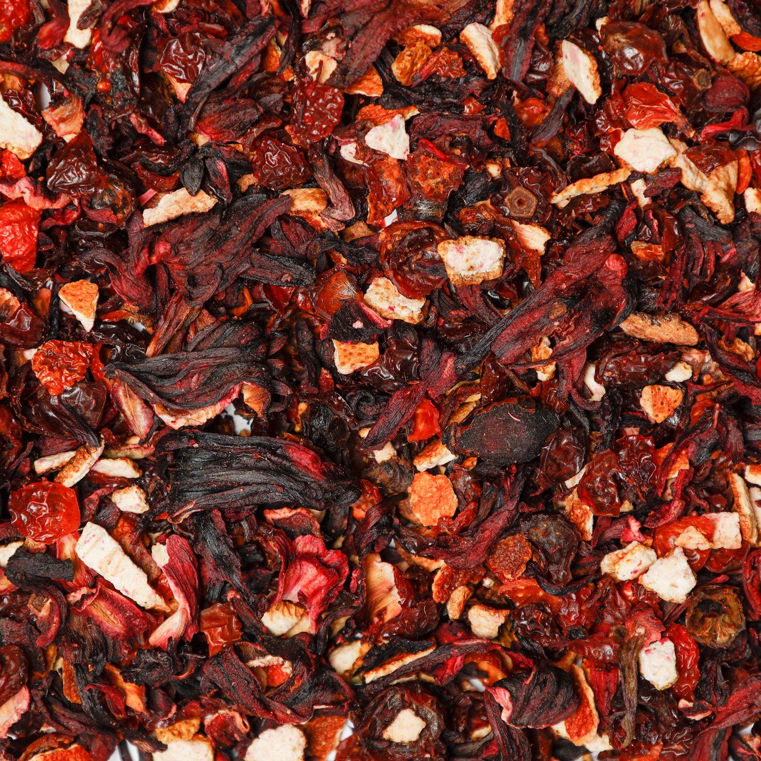 Loose-leaf hibiscus based blueberry and mango tea blend with dried fruit and botanicals. A small-batch herbal infusion by Waterloo Tea.

